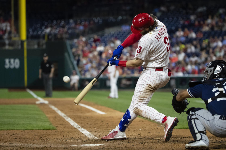 Philadelphia Phillies' Bryce Harper hits a home run off San Diego Padres' Michel Baez during the sixth inning of a baseball game Friday, Aug. 16, 2019, in Philadelphia. (AP Photo/Matt Rourke)