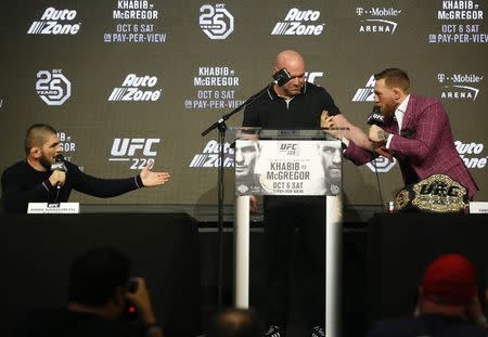 Sep 20, 2018; New York, NY, USA; Conor McGregor speaks to Khabib Nurmagomedov during a press conference for UFC 229 at Radio City Music Hall. Mandatory Credit: Noah K. Murray-USA TODAY Sports