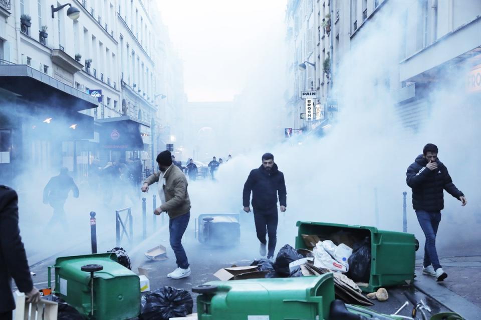 Protesters and police clash in central Paris (EPA)