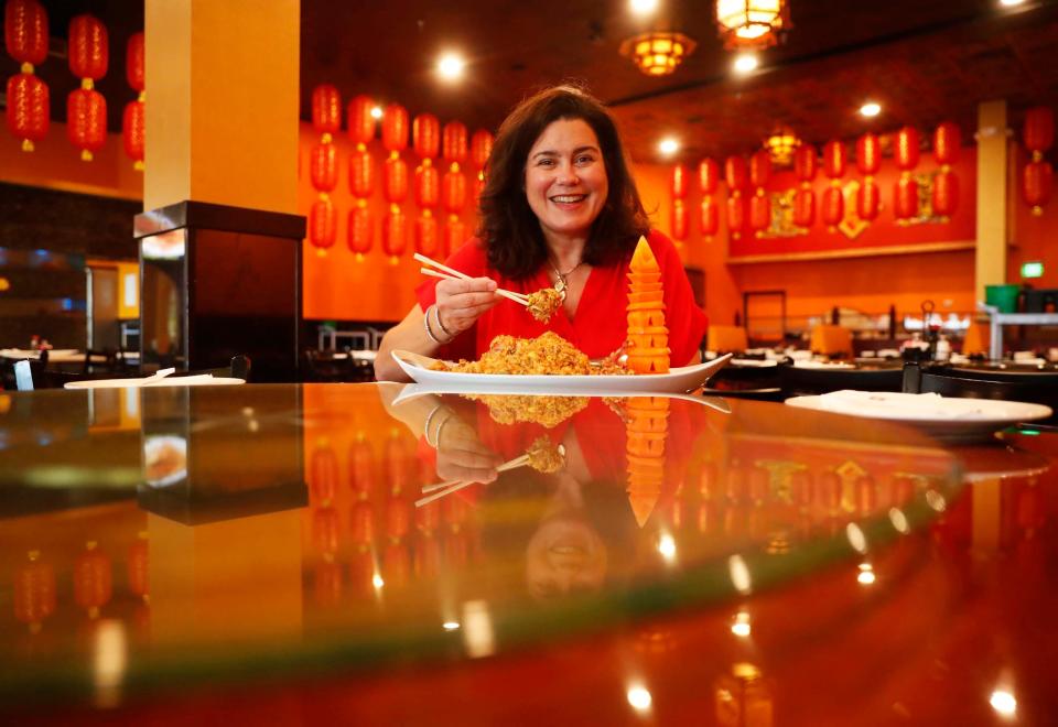 Food & Dining reporter Jennifer Chandler prepares to taste the Lobster Fried Rice on on Dec. 5 at Dim Sum King in Memphis.