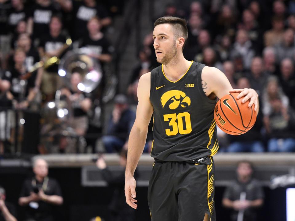 Iowa Hawkeyes guard Connor McCaffery dribbles in a 2023 game against Purdue.