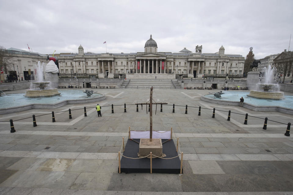 A crucifix placed in Trafalgar Square on Good Friday, the day Christians commemorate the crucifixion of Jesus and his death at Calvary, in London, Friday April 2, 2021. (Aaron Chown/PA via AP)