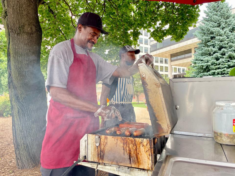 Jay Brown is cooking hot dogs and brats at Red Arrow Park in Milwaukee on Tuesday, July 16, 2024.