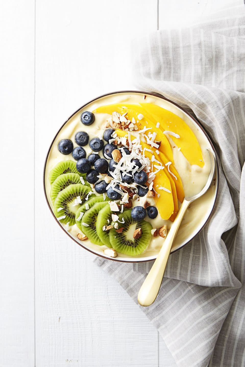 <p>Why put your smoothie in a bowl? One word: Toppings.<br></p><p>Get the recipe from <a href="https://www.goodhousekeeping.com/food-recipes/a38877/tropical-smoothie-bowl-recipe/" rel="nofollow noopener" target="_blank" data-ylk="slk:Good Housekeeping;elm:context_link;itc:0;sec:content-canvas" class="link ">Good Housekeeping</a>.</p>