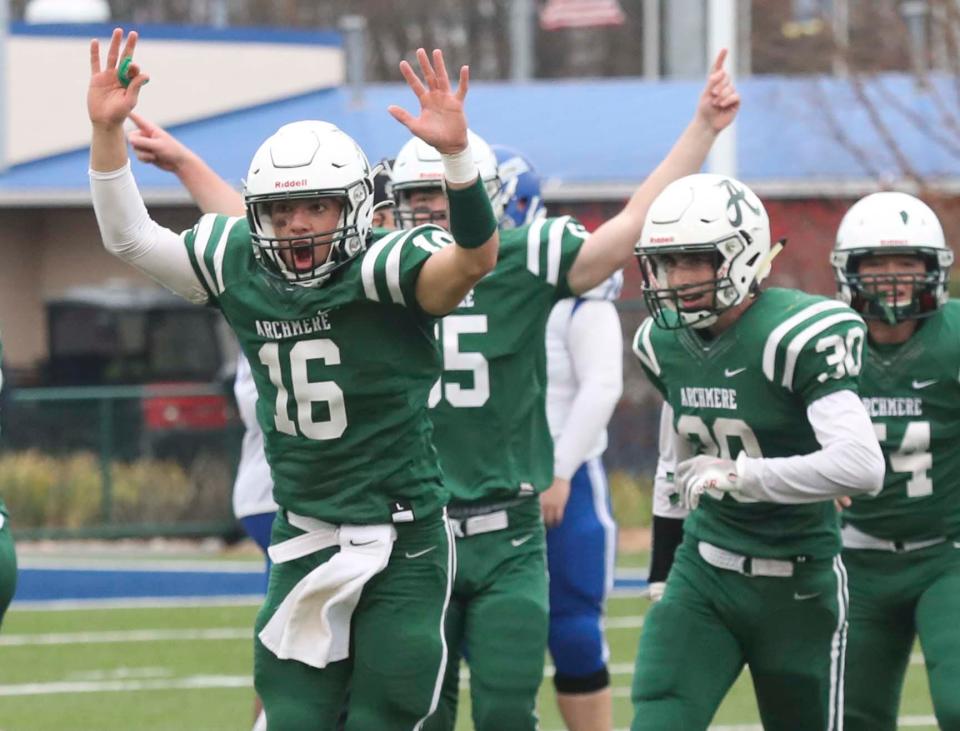 Archmere quarterback Chris Albero (16) and his teammates celebrate after blanking Woodbridge 27-0 in the 2021 DIAA Class 2A football championship game at Delaware Stadium.