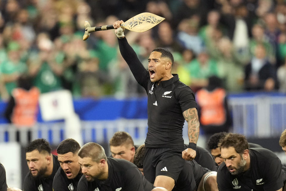 New Zealand's Aaron Smith leads the team as they perform the Haka just prior to the start of the Rugby World Cup quarterfinal match between Ireland and New Zealand at the Stade de France in Saint-Denis, near Paris Saturday, Oct. 14, 2023. (AP Photo/Christophe Ena)
