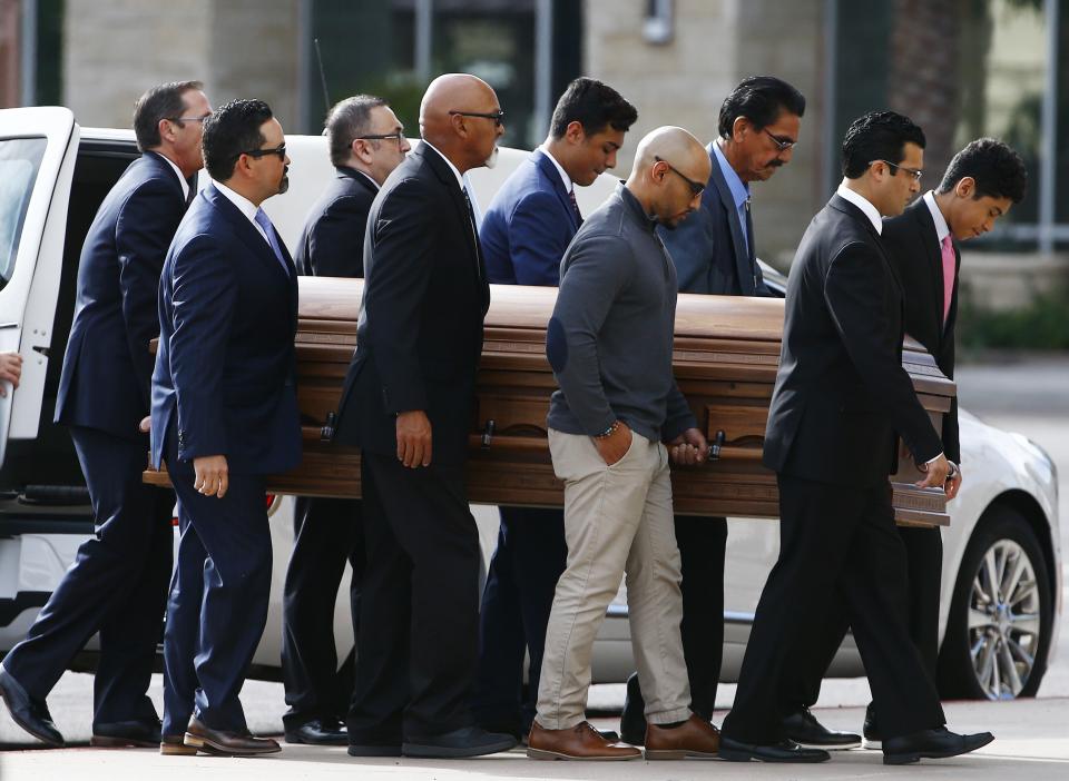 Pallbearers carry the casket of former Democratic U.S. Rep. Ed Pastor into St. Francis Xavier Catholic Church for his funeral Friday, Dec. 7, 2018, in Phoenix. Pastor was Arizona's first Hispanic member of Congress, spending 23 years in Congress before retiring in 2014. He passed away last week at the age of 75. (AP Photo/Ross D. Franklin)
