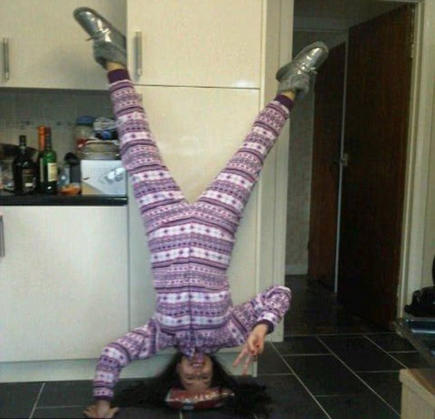 Imogen Thomas stood on her head in her new onesie after drinking a whole bottle of wine in the morning.