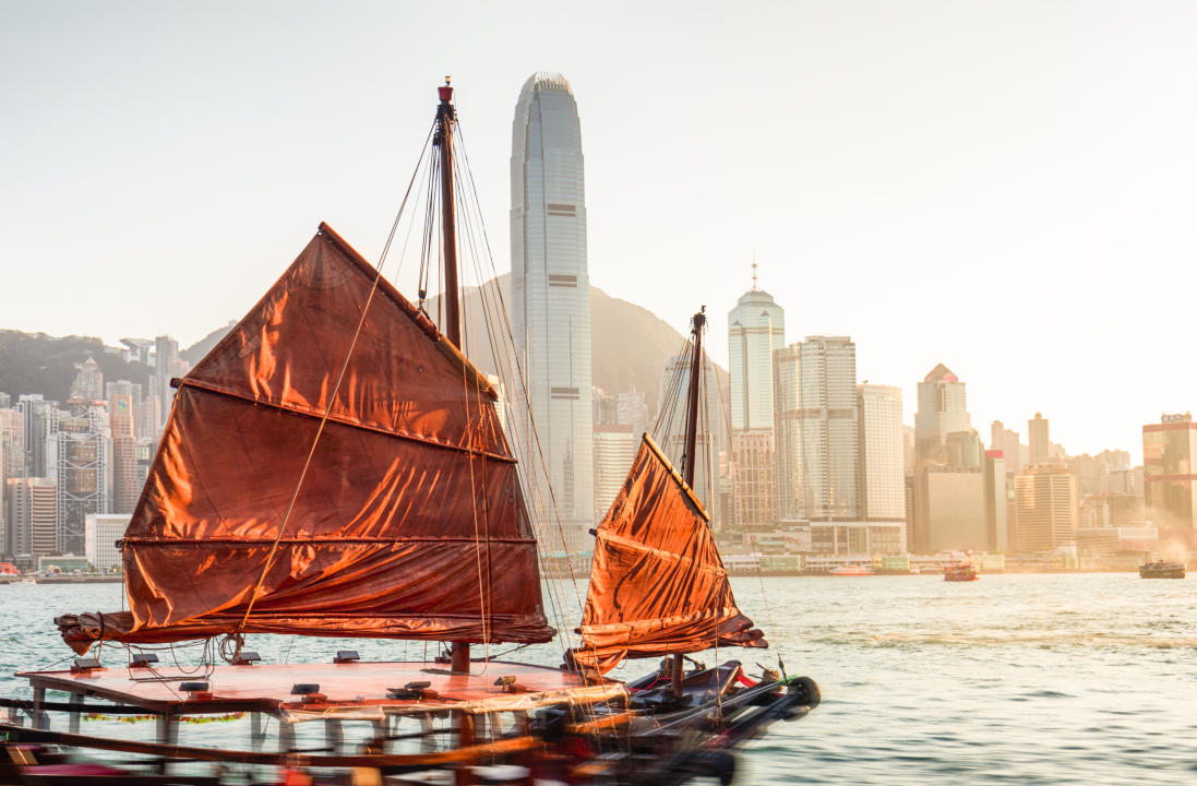 Junkboat sailing across Victoria Harbour, Hong Kong