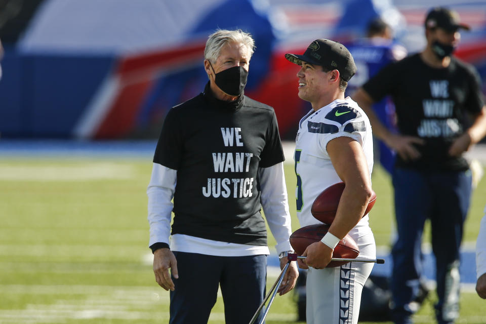 Seattle Seahawks head coach Pete Carroll, left, talks to kicker Jason Myers before an NFL football game against the Buffalo Bills Sunday, Nov. 8, 2020, in Orchard Park, N.Y. (AP Photo/John Munson)