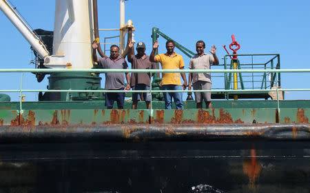 Crew members are seen aboard oil tanker Aris-13, which was released by pirates, as it sails to dock on the shores of the Gulf of Aden in the city of Bosasso, northern Somalia's semi-autonomous region of Puntland, March 19, 2017. REUTERS/Abdiqani Hassan FOR EDITORIAL USE ONLY. NO RESALES. NO ARCHIVES