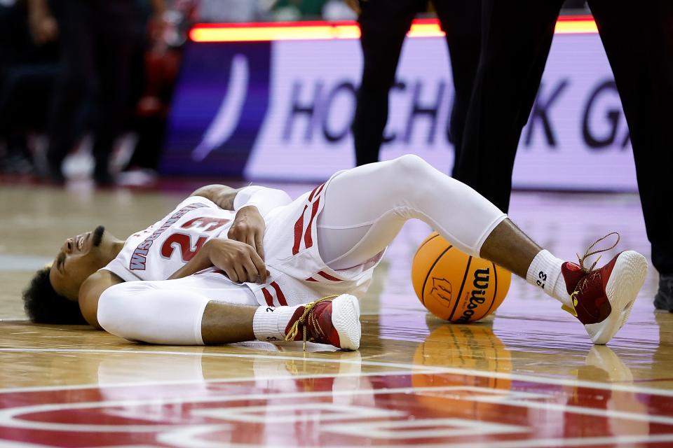 Wisconsin guard Chucky Hepburn lies on the floor after injuring his right groin during the second half against Chicago State on Friday night.