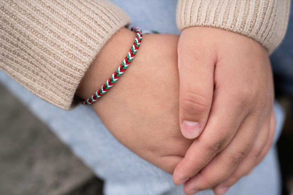 Nallely Segura wears a woven bracelet representing the colors of Mexico. Segura is a freshman at OSU studying pre-med and is a first generation college student, who came to the campus thanks to an innovative program that supports college access for students from migrant farmworker families.