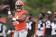 Cleveland Browns quarterback Deshaun Watson throws during an NFL football practice in Berea, Ohio, Sunday, Aug. 14, 2022. (AP Photo/David Dermer)