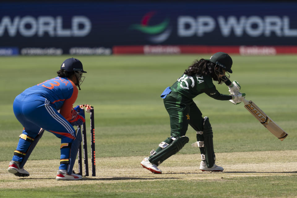 Pakistan's Gull Feroza is bowled by India's Renuka Singh during the ICC Women's T20 World Cup 2024 match between Pakistan and India at Dubai International Stadium, United Arab Emirates, Sunday, Oct. 6, 2024. (AP Photo/Altaf Qadri)