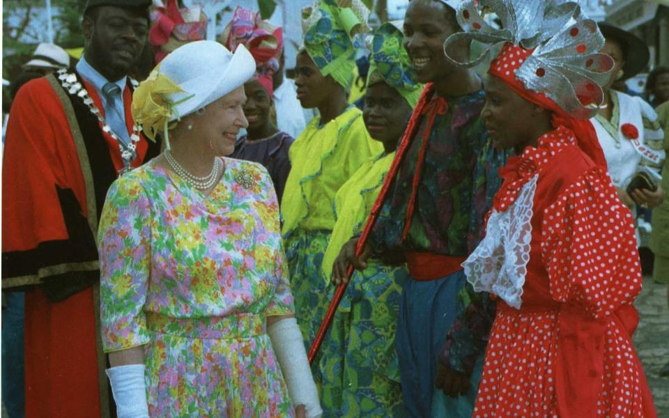 The Queen with Ashanti dancers at Montego Bay on the final day of her visit to Jamaica - Ian Jones Retained