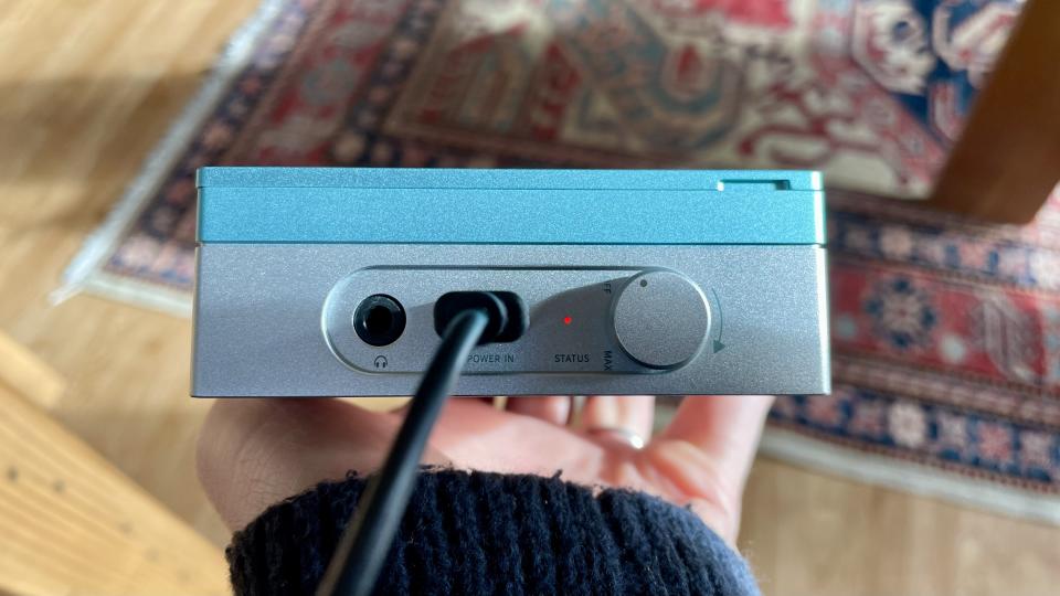 FiiO CP13 showing the USB-C port, held in a hand