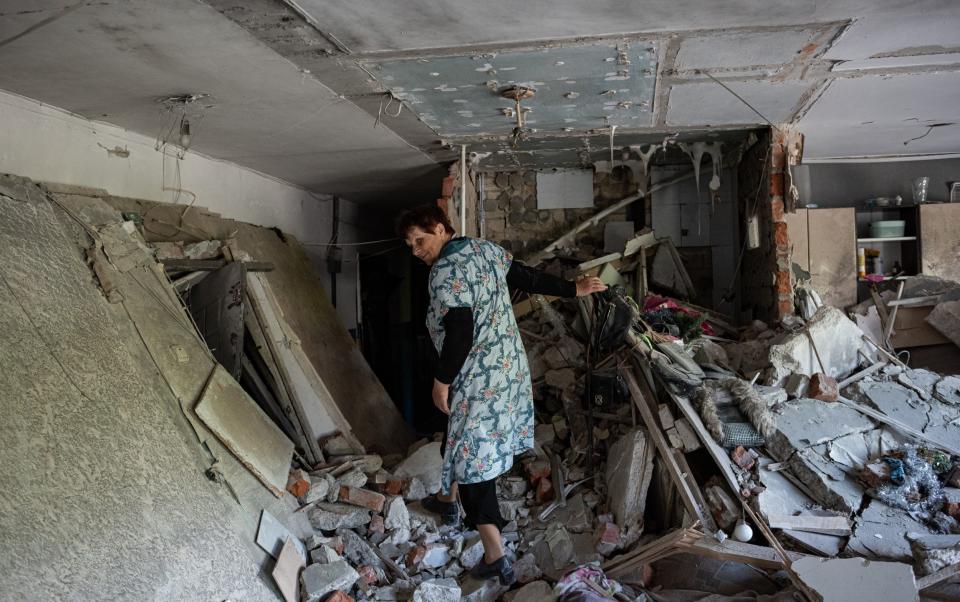 ‘War is peace’: a woman in a heavily damaged apartment building in Chernihiv - Alexey Furman