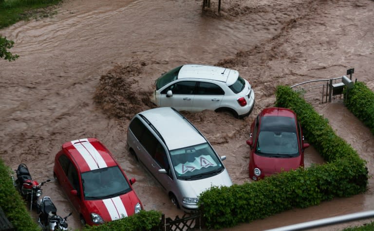 Cars are seen in a flooded street in Schwäbisch Gmünd, Baden-Württemberg, southern Germany after heavy rains hit the country on May 29, 2016