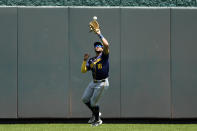 Milwaukee Brewers center fielder Blake Perkins catches a one-run sacrifice fly hit by Kansas City Royals' Vinnie Pasquantino during the first inning of a baseball game Wednesday, May 8, 2024, in Kansas City, Mo. (AP Photo/Charlie Riedel)
