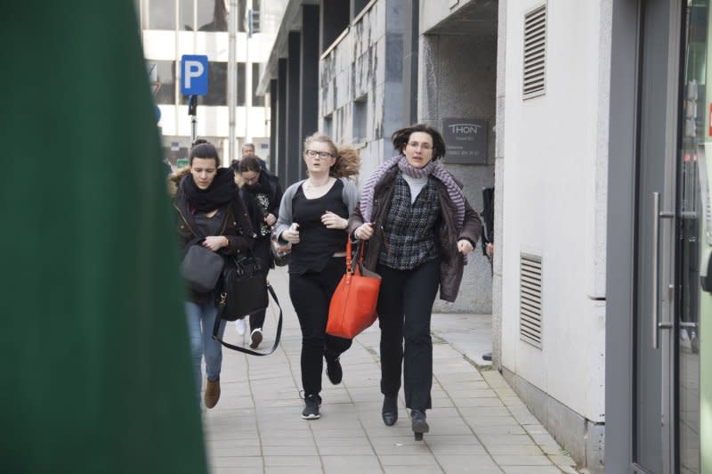 People run away from Brussels Airport after explosions rocked the facility March 22, 2016. File Photo by Diego Ravier/UPI