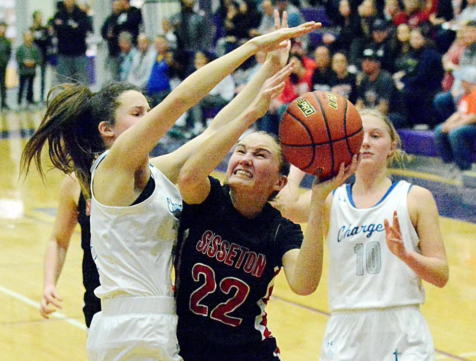 Sisseton's Emmalee Nielsen puts up a shot against Sioux Falls Christian's Jacksyn Swift and Ellie Lems (10) during their first-round game in the state Class A high school girls basketball tournament on Thursday, March 9, 2023 in the Watertown Civic Arena.