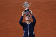 Czech Republic's Barbora Krejcikova lifts the cup after defeating Russia's Anastasia Pavlyuchenkova during their final match of the French Open tennis tournament at the Roland Garros stadium Saturday, June 12, 2021 in Paris. The unseeded Czech player defeated Anastasia Pavlyuchenkova 6-1, 2-6, 6-4 in the final. (AP Photo/Christophe Ena)