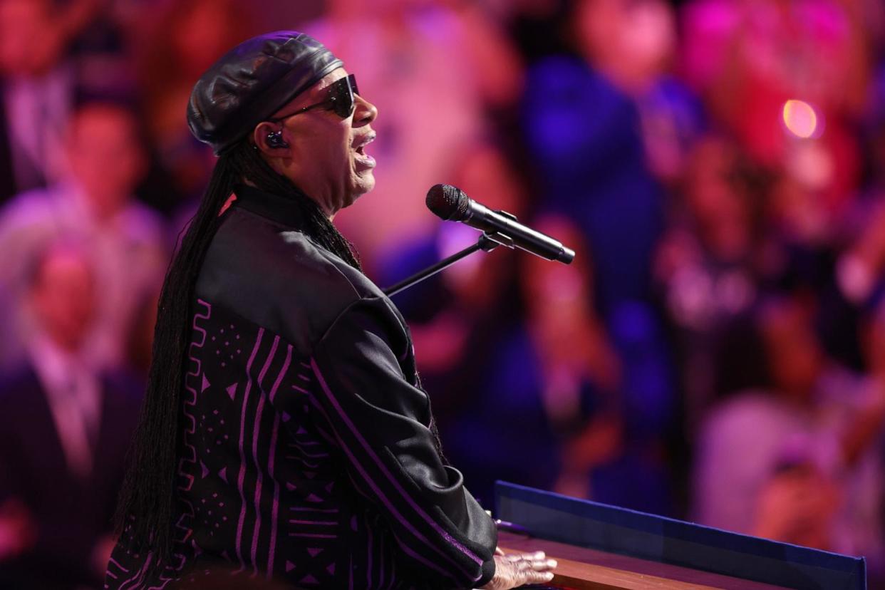 PHOTO: Musician Stevie Wonder performs on stage on Day 3 of the Democratic National Convention at the United Center on Aug. 21, 2024 in Chicago. (Win Mcnamee/Getty Images)