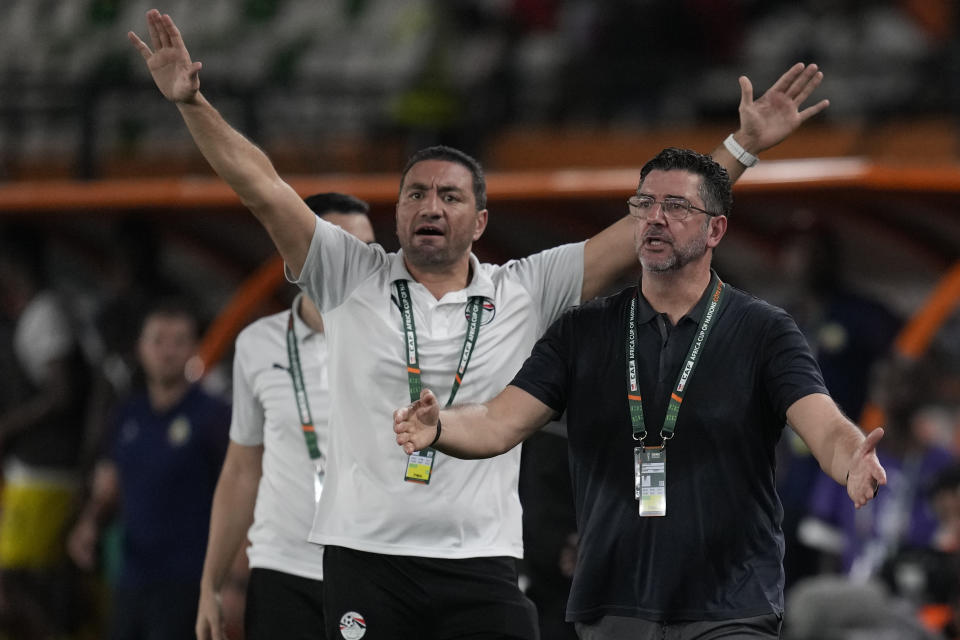 Egypt's head coach Rui Vitoria, right reacts to a potential penalty, which was give to Egypt after a VAR review during the African Cup of Nations Group B soccer match between Egypt and Mozambique in Abidjan, Ivory Coast, Sunday, Jan. 14, 2024. (AP Photo/Themba Hadebe)