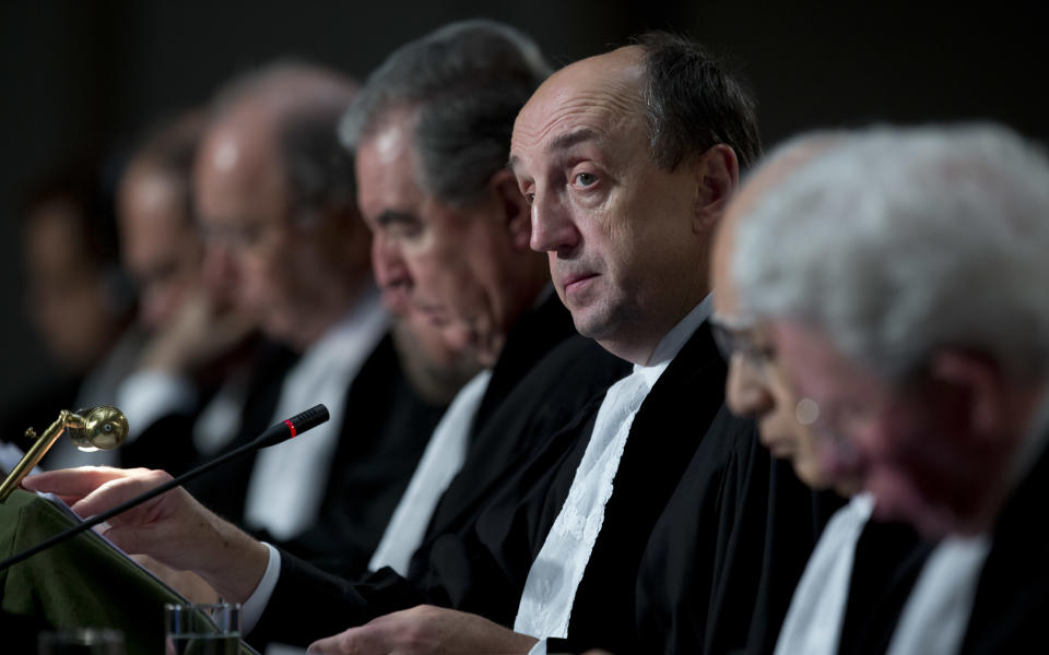 Presiding judge Tomka, third from right, opens the hearings in a dispute between Peru and Chile over the two countries' maritime boundary at the International Court of Justice in The Hague, Monday Dec. 3, 2012. (AP Photo/Peter Dejong)