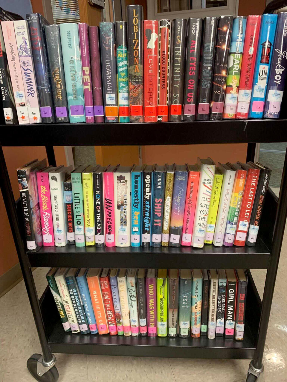 A photo taken by a teacher shows a cart full of books as they were being removed from a North East ISD library in December. (Obtained by NBC News)