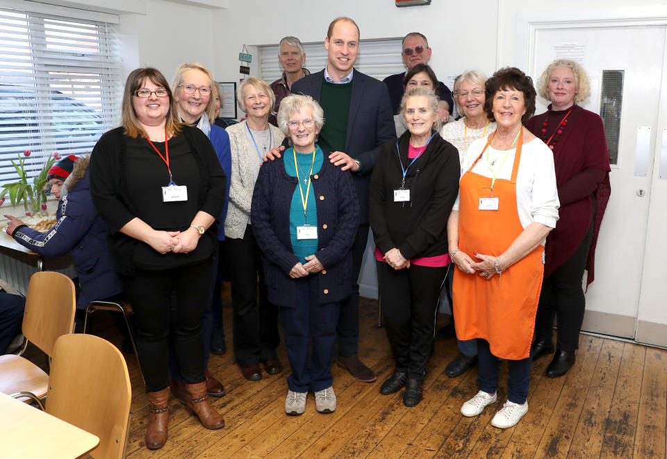 The Duke of Cambridge poses with volunteers during a visit to the Beacon Project, a day centre which gives support to the homeless, excluded and marginalized in Mansfield, Nottinghamshire.