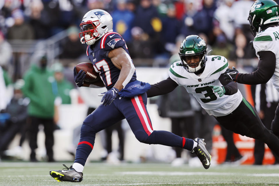 New England Patriots running back Damien Harris (37) tries to outrun New York Jets safety Jordan Whitehead (3) during the first half of an NFL football game, Sunday, Nov. 20, 2022, in Foxborough, Mass. (AP Photo/Michael Dwyer)