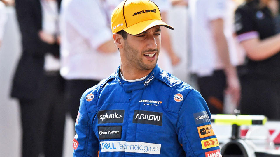 Daniel Ricciardo (pictured) walking after a pre-season photoshoot for McLaren.