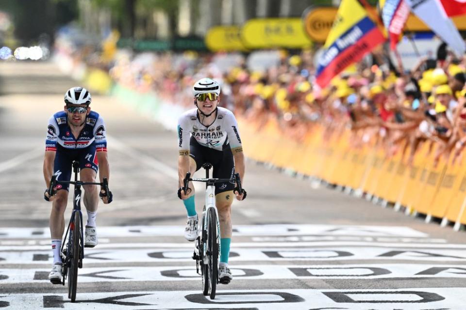 Bahrain  Victorious Slovenian rider Matej Mohoric R cycles past the finish line with Soudal QuickSteps Danish rider Kasper Asgreen L to win the 19th stage of the 110th edition of the Tour de France cycling race 173 km between MoiransenMontagne and Poligny in the Jura department of centraleastern France on July 21 2023 Photo by Marco BERTORELLO  AFP Photo by MARCO BERTORELLOAFP via Getty Images