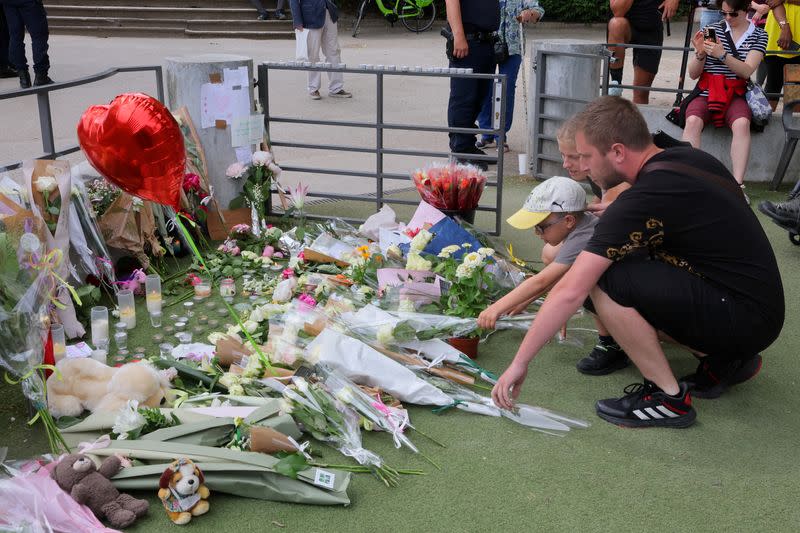 Tribute for victims the day after knife attack in French alpine town of Annecy