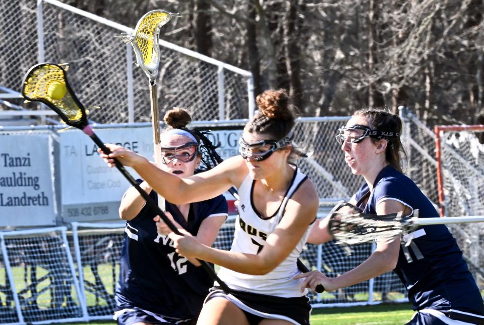 NORTH EASTHAM  04/15/22   Emily Pearl of Nauset moves between Maddy Fratus and Addie Pyy of Plymouth North.   girls lacrosse