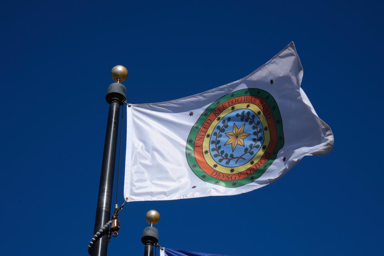 A flag representing the United Keetoowah Band of Cherokee Indians, of Tahlequah, flies in the Tribal Flag Plaza at the Oklahoma Capitol.