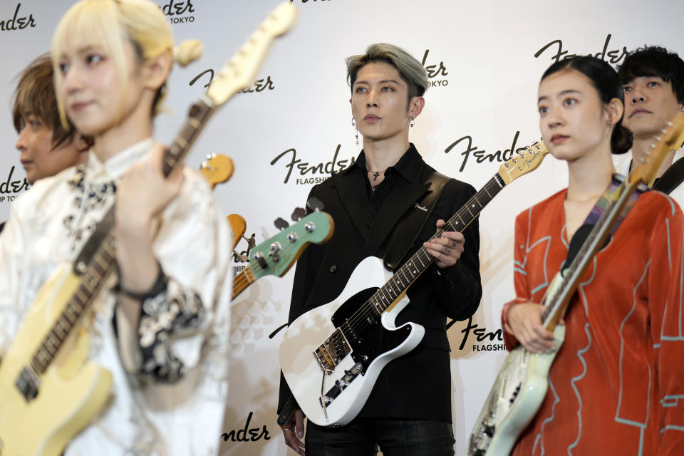 Japanese guitarist Miyavi with other guests attend the opening ceremony of Fender's Tokyo store Thursday, June 29, 2023. Fender, the guitar of choice for some of the world’s biggest stars from Jimi Hendrix to Eric Clapton, is opening what it calls its “first flagship store” in its 77-year history. (AP Photo/Eugene Hoshiko)