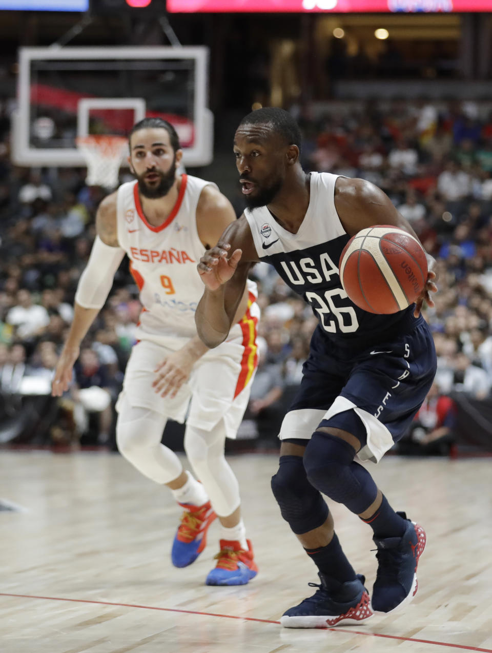 United States' Kemba Walker, right, dribbles past Spain's Ricky Rubio during the second half of an exhibition basketball game Friday, Aug. 16, 2019, in Anaheim, Calif. (AP Photo/Marcio Jose Sanchez)