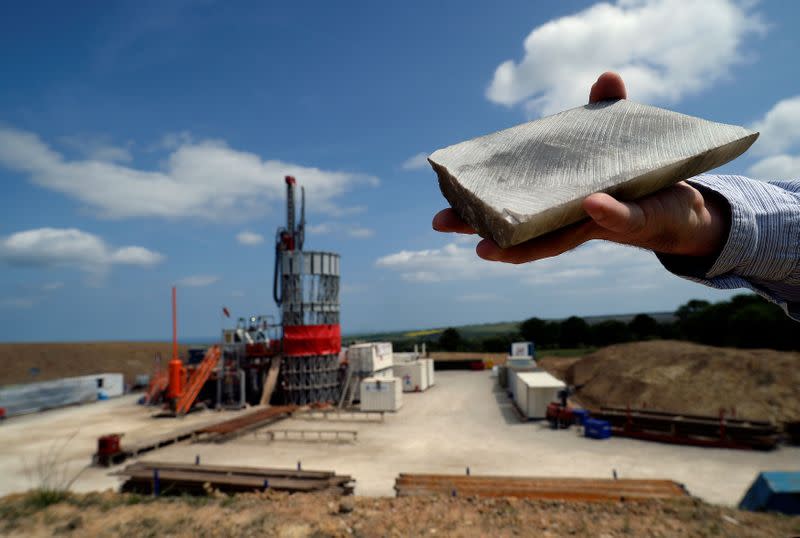 FILE PHOTO: An employee holds a sample of polyhalite taken from the Sirius Minerals test drilling station on the North Yorkshire Moors near Whitby