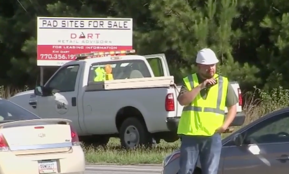 An undercover officer in Georgia informs uniformed police of a violation he's spotted via a walkie-talkie.