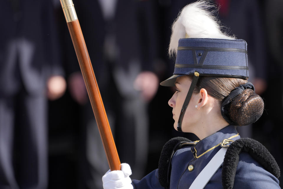 A standard-bearer of a Portuguese military vocational school takes part in a military parade at Lisbon's Comercio square, Thursday, April 25, 2024, during celebrations of the fiftieth anniversary of the Carnation Revolution. The April 25, 1974 revolution carried out by the army restored democracy in Portugal after 48 years of a fascist dictatorship. (AP Photo/Armando Franca)