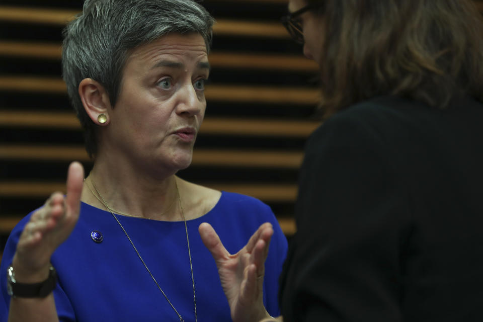 European Competition Commissioner Margrethe Vestager, left, talks to Trade Commissioner Cecilia Malmstrom prior the weekly College of Commissioners meeting at EU headquarters in Brussels, Wednesday, Feb. 6, 2019. European Union authorities on Wednesday rejected a massive rail merger deal between France's Alstom and Germany's Siemens in what the two nations had hoped would have created a global competitor to stand up to China. (AP Photo/Francisco Seco)