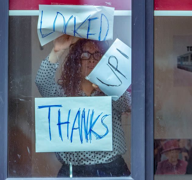 Signs posted on a window at Manchester Metropolitan University's Birley campus, on Monday