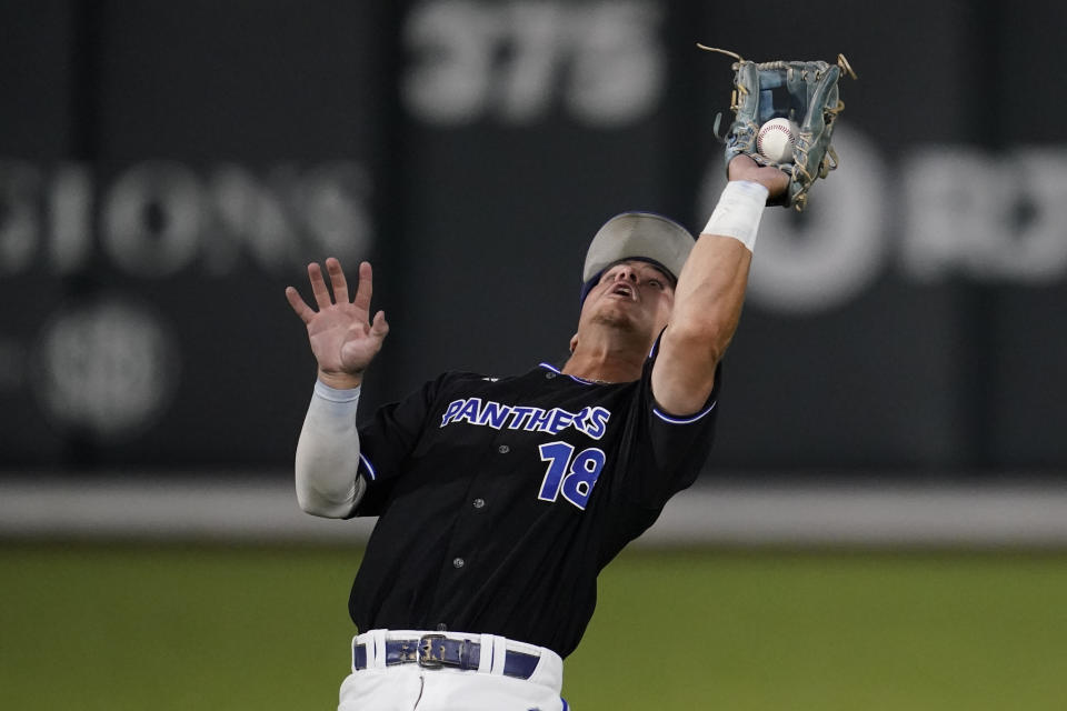 Eastern Illinois shortstop Chris Worcester catches a fly ball during the eighth inning of an NCAA college baseball tournament regional game against Vanderbilt, Friday, June 2, 2023, in Nashville, Tenn. (AP Photo/George Walker IV)