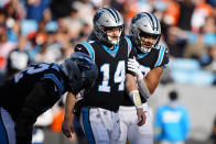 Carolina Panthers quarterback Sam Darnold (14) celebrates after scoring during the second half of an NFL football game between the Carolina Panthers and the Denver Broncos on Sunday, Nov. 27, 2022, in Charlotte, N.C. (AP Photo/Jacob Kupferman)