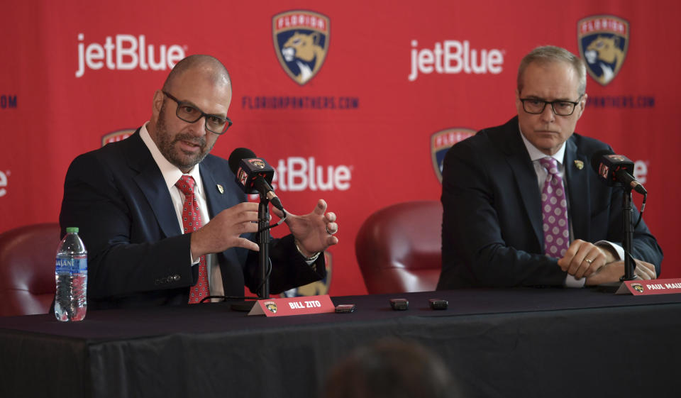 Bill Zito, left, general manager of the Florida Panthers, and Paul Maurice, new head coach of the Panthers, take questions during an NHL hockey news conference at FLA Live Arena, Friday, June 23, 2022, in Sunrise, Fla. (AP Photo/Jim Rassol)