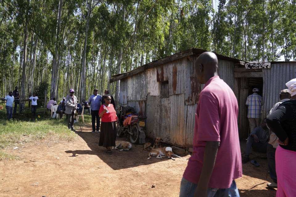 Family and friends gather to mourn Anthony Shungea Pasha who was thoroughly dismembered and killed by hyenas while he was collecting firewood at a forest neighbouring his homestead, in Kajiado, Kenya Tuesday, Feb. 6, 2024. The wild animals from the Nairobi National Park have been distressing the community. "Everything has been killed in this homestead. Cows were killed, goats and now its people. We haven't found any part of the deceased. We have not been given any help," Gladys Maingu, relative to Pasha, echoed. (AP Photo/Brian Inganga)