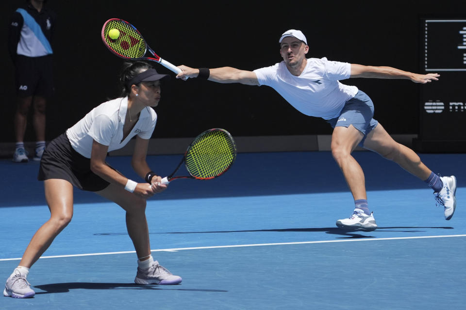 Jan Zielinski of Poland, right, and Hsieh Su-Wei of Taiwan in action against Desirae Krawczyk of the U.S. and Neal Skupski of Britain during the mixed doubles final at the Australian Open tennis championships at Melbourne Park, Melbourne, Australia, Friday, Jan. 26, 2024. (AP Photo/Andy Wong)